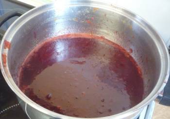 Plums simmering in a pan