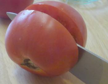 Cut tomato in half